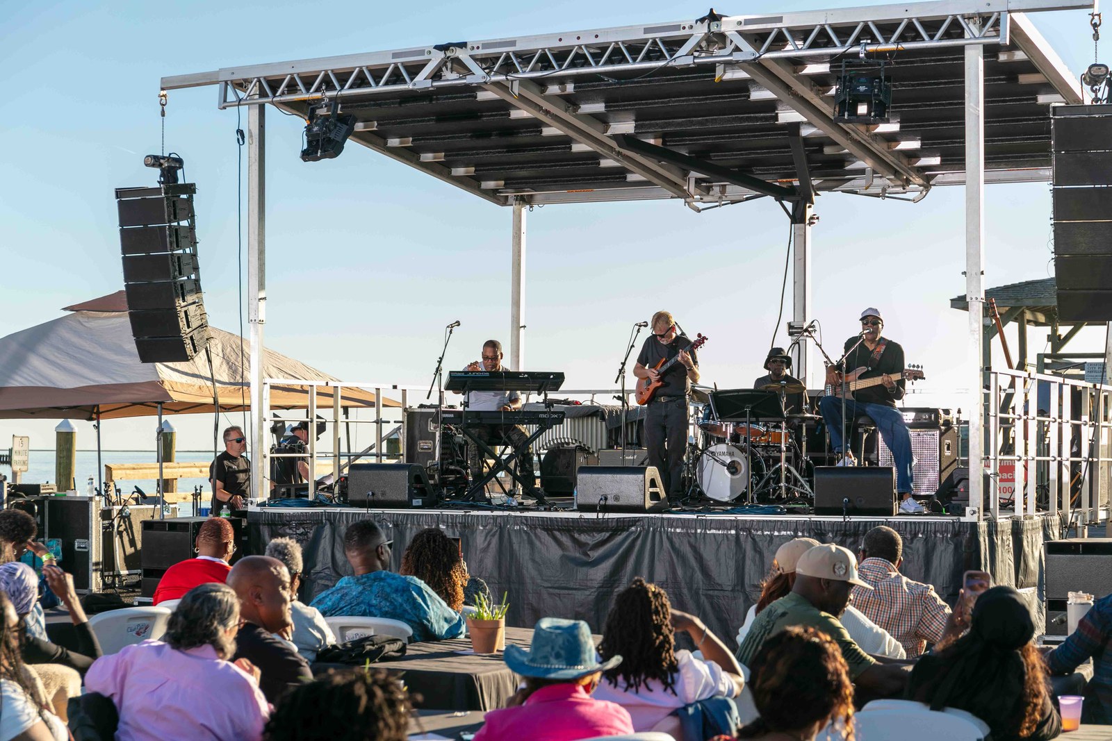 The festival stage with guests gathered in front