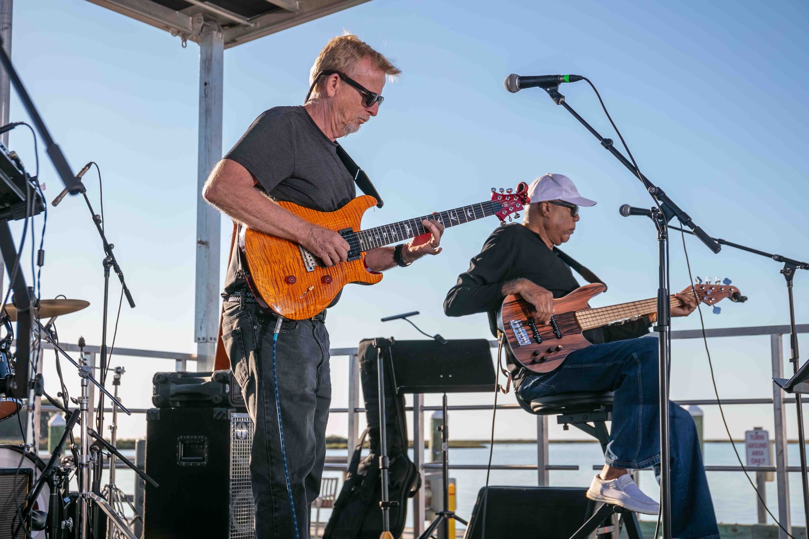 A guitarist and bassist performing together