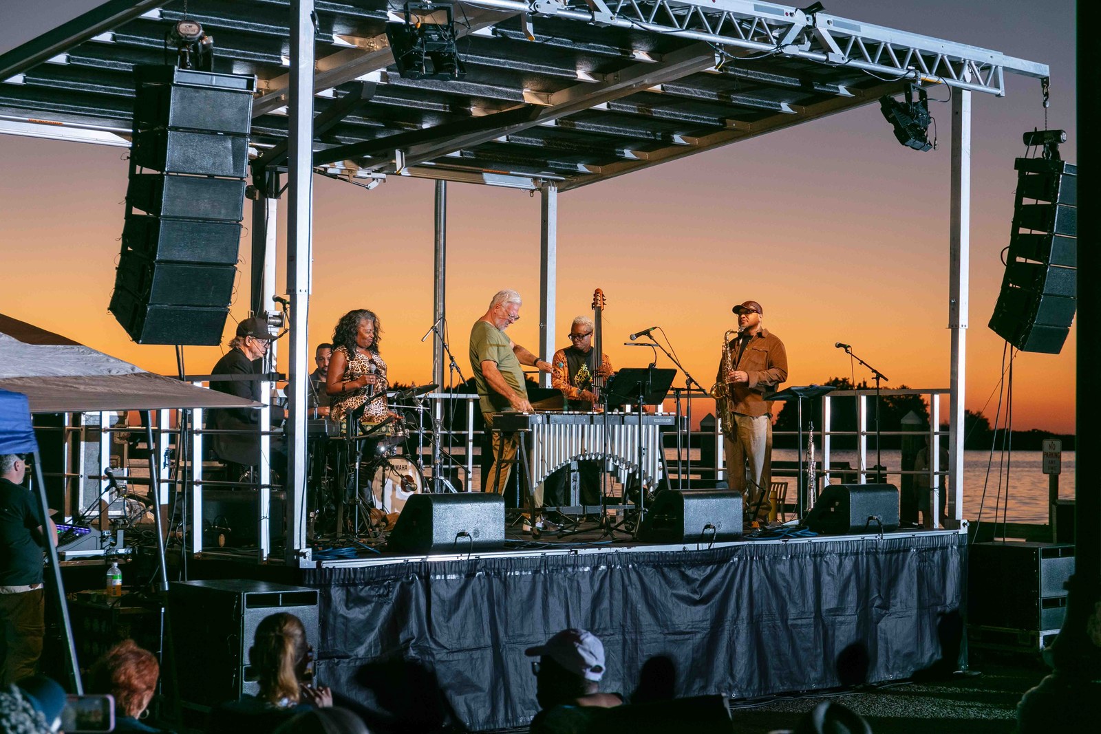 Musicians performing in the warm sunset