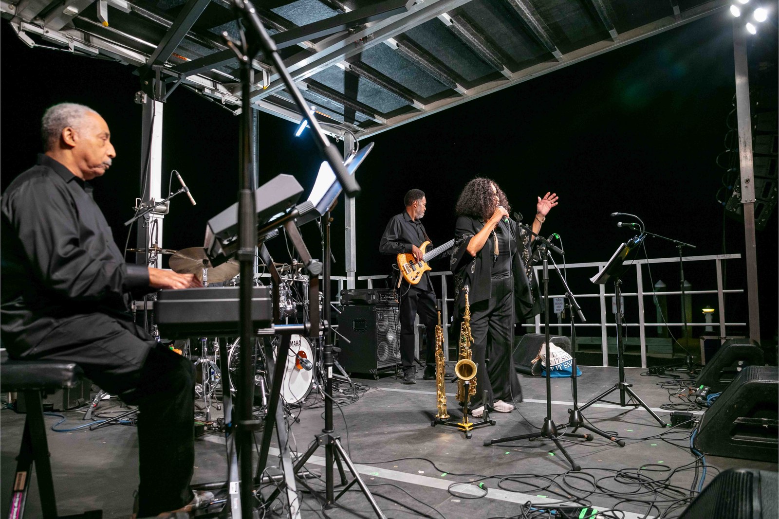 The jazz ensemble performing under the pavilion